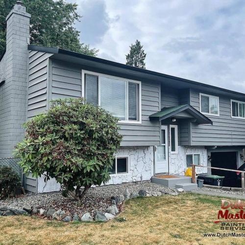  | Modernized the exterior of this home using a rich & warm tone Chelsea Gray (HC-168) from Benjamin Moore. We used Tricorn Black (SW 6258) from Sherwin Williams all the trim & white washed the front exterior stone adding instant curb appeal! | Exterior Painting 